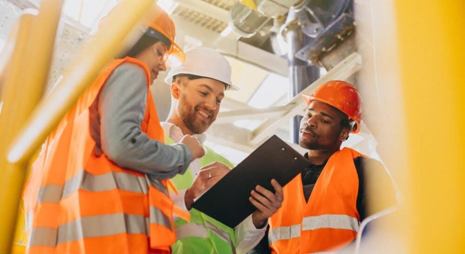 safety-workers-discussing-plan-on-site